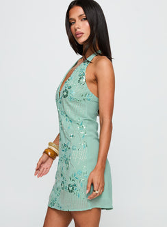 side view of model wearing Princess Polly Telenova Halter Mini Dress Green Plunger 