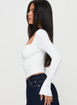 side view of model wearing Princess Polly Sampson Long Sleeve Top White Full Sleeves Plunger 