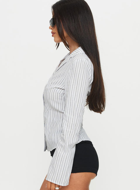 side view of model wearing Princess Polly Myers Stripe Top White Full Sleeves V-Neck 