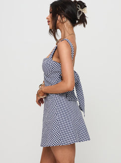side view of model wearing Princess Polly Mcbeath Mini Dress Navy Check Sweetheart Neckline 