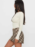   side view of model wearing Princess Polly Point Of View Mini Skirt Brown Check Mini Skirts 