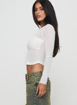 side view of model wearing Princess Polly November Long Sleeve Top White Full Sleeves Crew Neck 