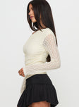 side view of model wearing Princess Polly Beller Long Sleeve Lace Top Cream Full Sleeves Asymmetric Neckline 