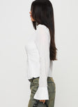 side view of model wearing Princess Polly Elowenn Long Sleeve Top White Full Sleeves V-Neck 