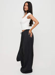 side view of model wearing Princess Polly Harbour Pant Black Petite High Waisted Pants 