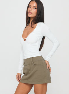   side view of model wearing Princess Polly Giorja Studded Cargo Mini Skirt Khaki Mini Skirts 