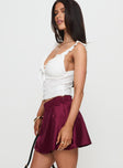   side view of model wearing Princess Polly For Me Mini Skirt Burgundy Mini Skirts 