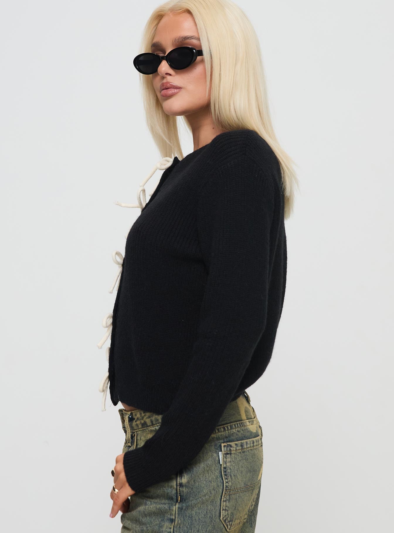 side view of model wearing Princess Polly Rosalee Cardigan Black / White Cropped 