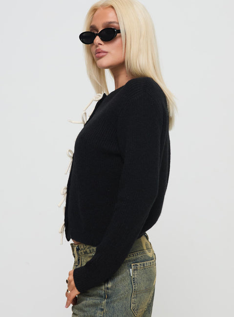 side view of model wearing Princess Polly Rosalee Cardigan Black / White Cropped 