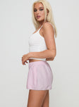 side view of model wearing Princess Polly Orielle Low Rise Boxer Short Pink High Waisted Shorts 