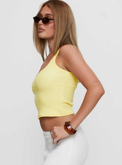 side view of model wearing Princess Polly Baseline Square Neck Rib Tank Top Lemon Sleeveless Square Neck 
