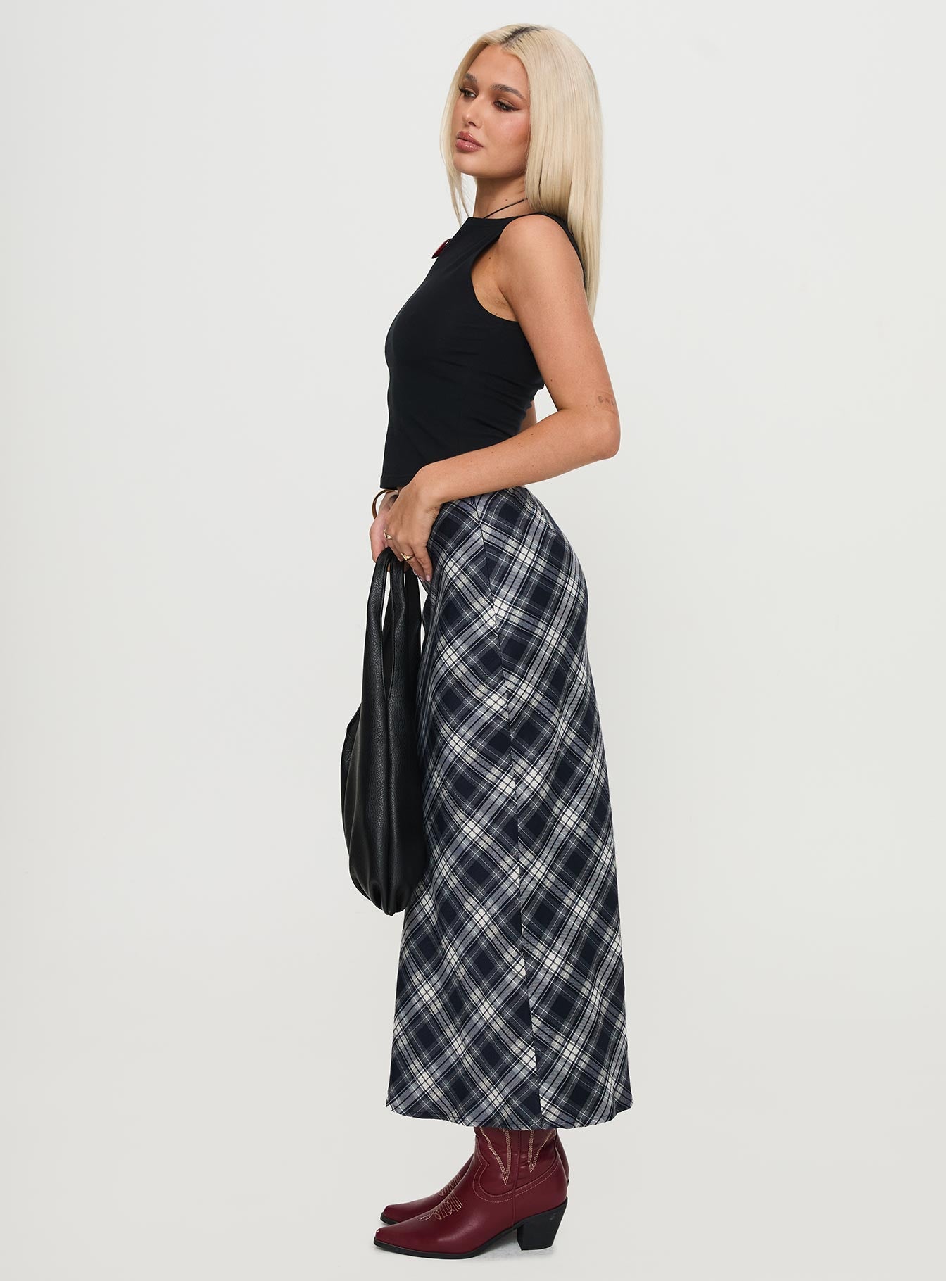  side view of model wearing Princess Polly Everlie Low Waist Maxi Skirt Check Multi 