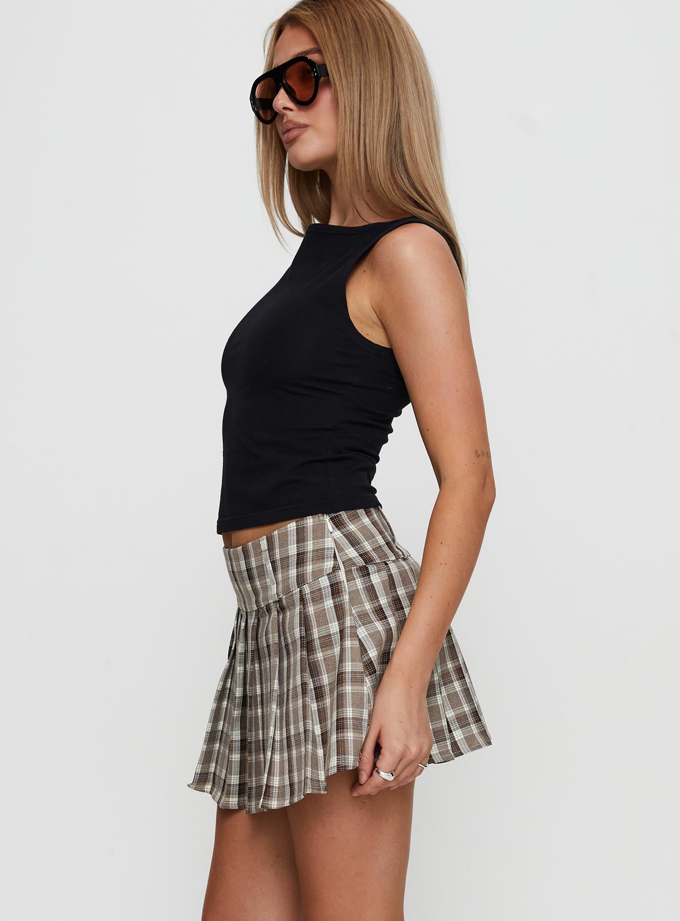   side view of model wearing Princess Polly Envision Pleat Mini Skirt Brown Multi Mini Skirts 