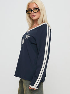 side view of model wearing Princess Polly Spectate Top Long Sleeve Navy Full Sleeves V-Neck 