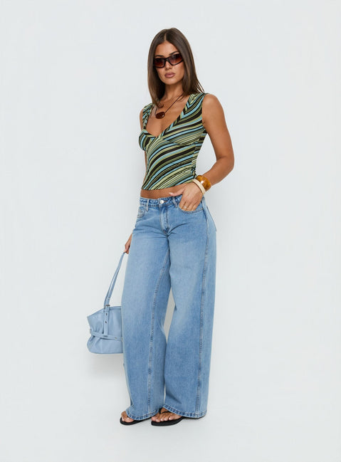 back view of model wearing Princess Polly Ramos Low Rise Denim Jeans Bright Blue Wash Mid Rise Jeans 