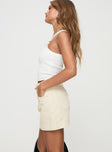 side view of model wearing Princess Polly Gazelle Denim Skort Cream High Waisted Shorts 