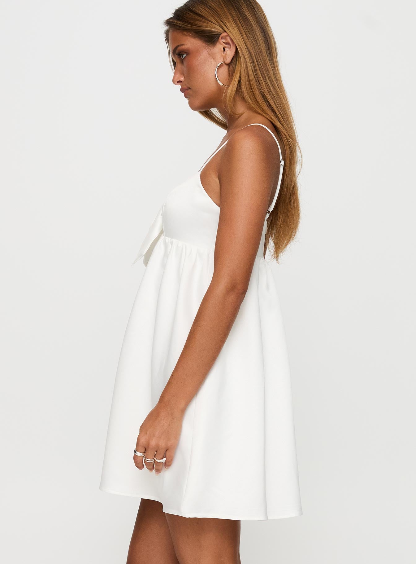 side view of model wearing Princess Polly Wilmina Mini Dress White Sweetheart Neckline 