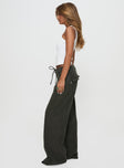 side view of model wearing Princess Polly Bruiser Tie Waist Jeans Green High Waisted 