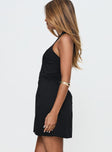 side view of model wearing Princess Polly Mallorie Halter Mini Dress Black Scoop Neck 