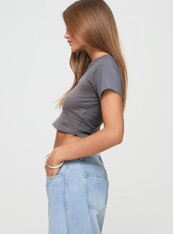 side view of model wearing Princess Polly Racing Florence Baby Tee Black Short Sleeves Crew Neck 