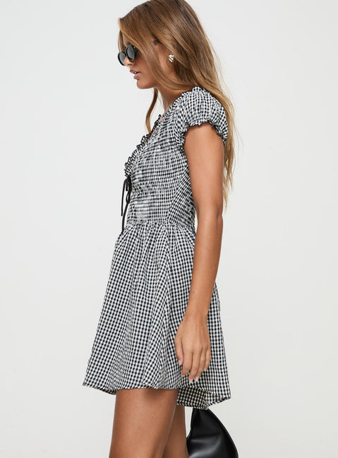 Black and white Gingham romper Puff sleeve, deep v neckline, shirred material, invisible zip fastening down back