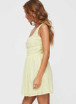 side view of model wearing Princess Polly Lorinda Mini Dress Yellow Petite Square Neck 