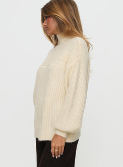 side view of model wearing Princess Polly Wistfully Funnel Neck Knit Sweater Cream Long 