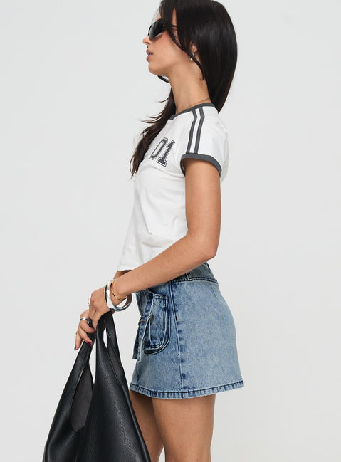   side view of model wearing Princess Polly Take Time Denim Mini Skirt Mid Wash Mini Skirts 