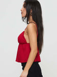 side view of model wearing Princess Polly Missoura Top Red Sleeveless Plunger 