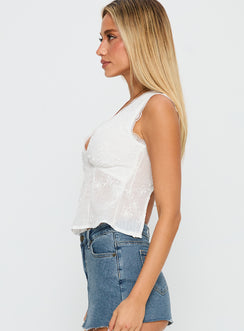 side view of model wearing Princess Polly Hagea Top White Sleeveless Plunger 