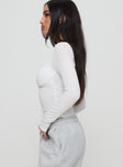 side view of model wearing Princess Polly Lunella Bodysuit White Full Sleeves 