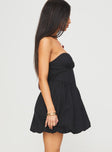 side view of model wearing Princess Polly Zafira Strapless Bubble Hem Mini Dress Black Sweetheart Neckline 