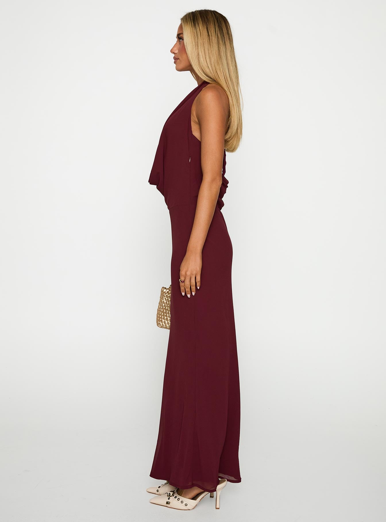 side view of model wearing Princess Polly Vortexa Halter Maxi Dress Currant Plunger 