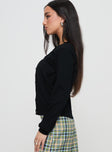 side view of model wearing Princess Polly Capeside Knit Cardigan Black Cropped 