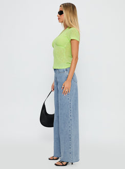 side view of model wearing Princess Polly Darla Low Rise Straight Jean Vintage Blue Wash Low Rise Jeans 