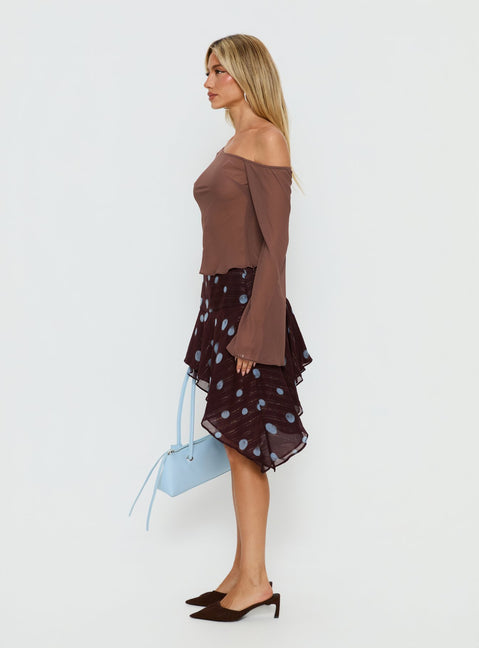   side view of model wearing Princess Polly Hevenna Asymmetrical Chiffon Mini Skirt Brown / Blue Polka 