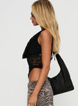 side view of model wearing Princess Polly Maryam Lace Top Black Sleeveless Cowl 