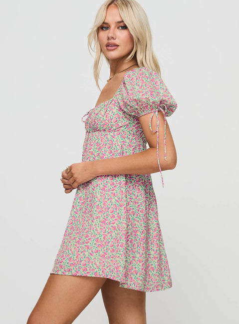 side view of model wearing Princess Polly Larsson Mini Dress Pink Floral Square Neck 