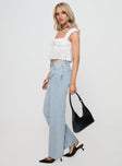 side view of model wearing Princess Polly Copperfield Baggy Denim Jeans Light Blue Wash High Waisted 