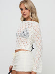 side view of model wearing Princess Polly Maddalyn Crochet Top White Full Sleeves Boat Neck 