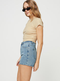 side view of model wearing Princess Polly Shaline Shorts Light Wash Denim High Waisted Shorts 