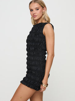 side view of model wearing Princess Polly Guccio Mini Dress Onyx Boat Neck 