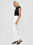 side view of model wearing Princess Polly Jazzar Pocket Detail Pleated Pant White Petite High Waisted Pants 