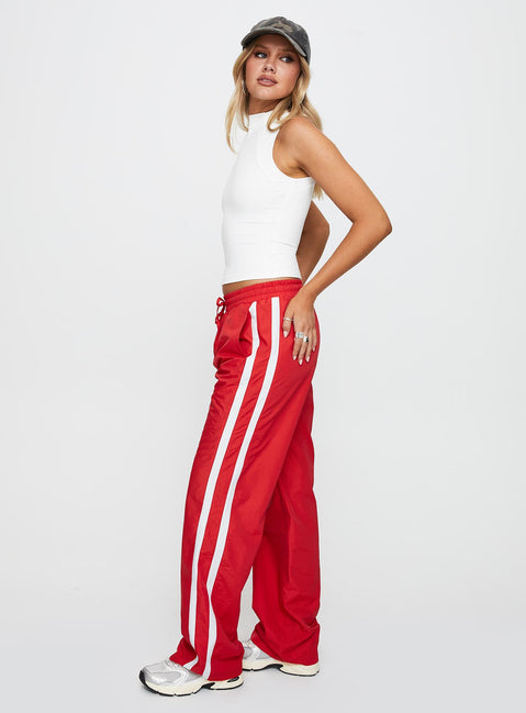 side view of model wearing Princess Polly Keli Track Pants Red / White High Waisted Pants 