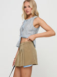   side view of model wearing Princess Polly Spheres Pleat Mini Skirt Beige Mini Skirts 