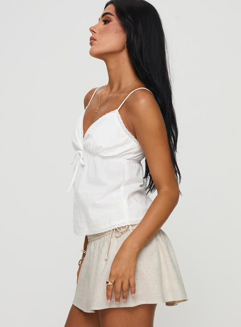 side view of model wearing Princess Polly Hickory Top White Sleeveless V-Neck 