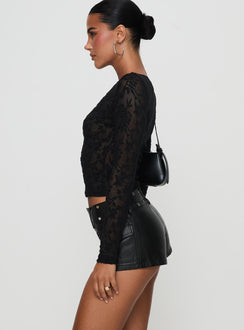 side view of model wearing Princess Polly Born To Ride Shorts Washed Black Low Rise Shorts 