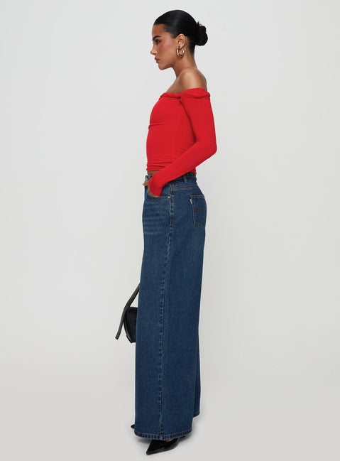 side view of model wearing Princess Polly Naylor Rip Wide Leg Jeans Dark Blue Wash Mid Rise 
