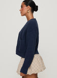 side view of model wearing Princess Polly Osias Cable Knit Cardigan Navy Cropped 