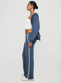 side view of model wearing Princess Polly Skiller Side Stripe Track Pants Navy High Waisted Pants 